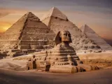 Egyptian pyramids of Giza viewed across the desert plateau at sunrise