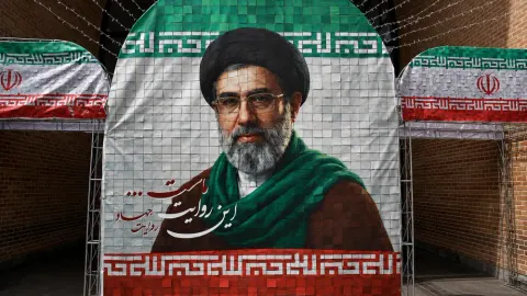 West Asia war updates showing an Iranian supreme leader banner in Tehran