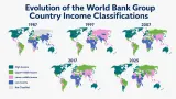 Economist reviewing World Bank Group Country Income Classifications on a global data map
