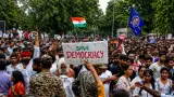 Cockroach protesters gathered near police barricades during the Delhi march toward India’s parliament