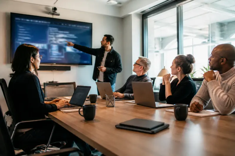 A team discussing effective cybersecurity defense strategies
