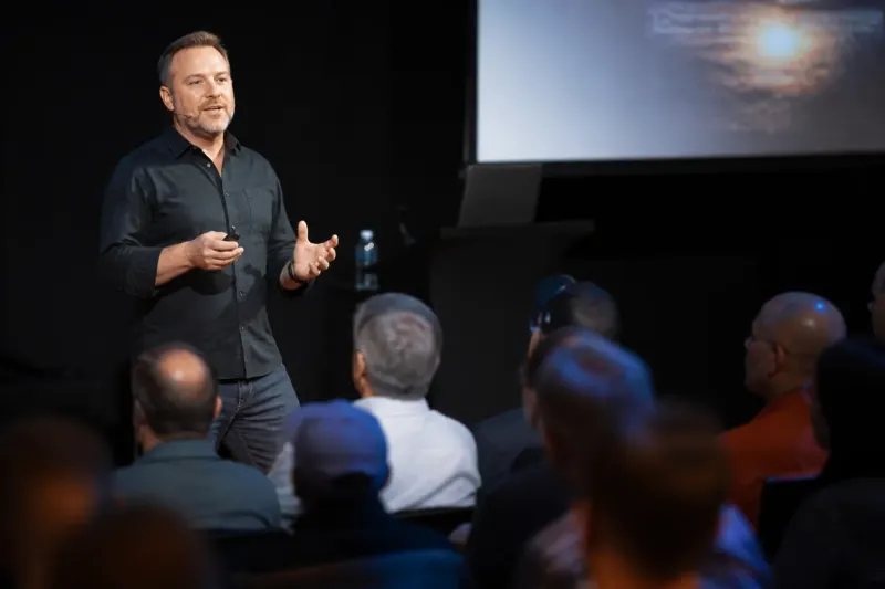 Chris Hosking presenting insights on AI security challenges