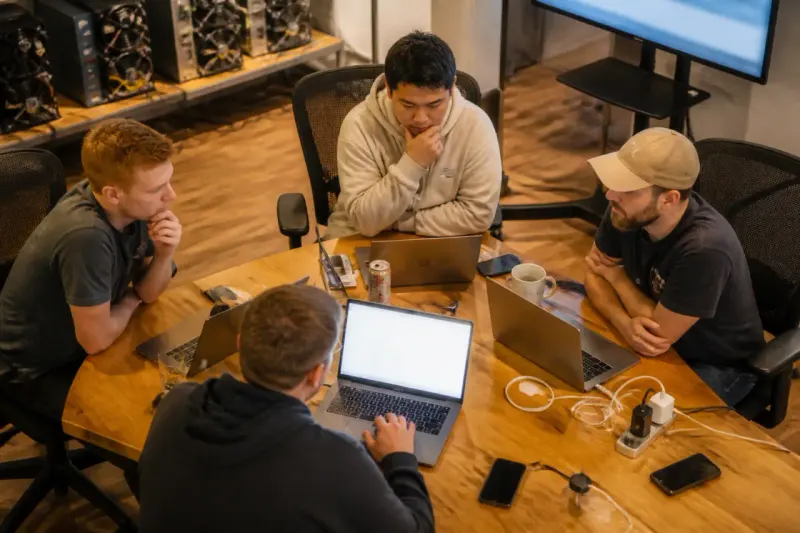 A team working on Bitcoin mining strategies