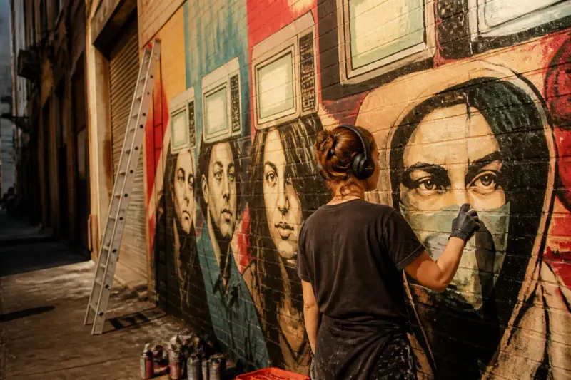 A graffiti mural depicting public sentiments about AI and technology