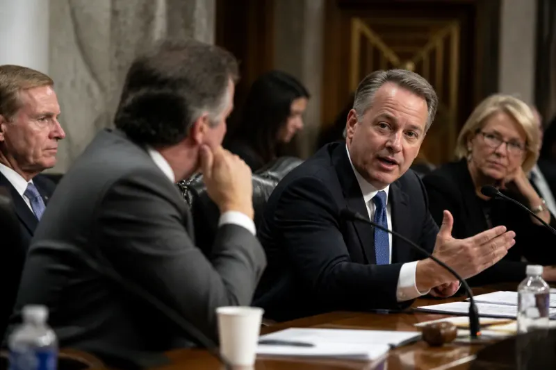 Legislators discussing Palantir's government contracts in a committee meeting.