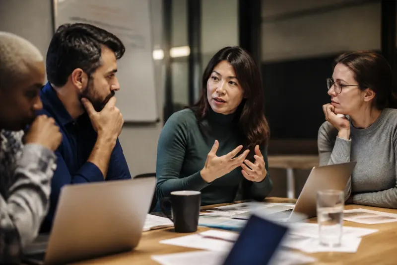 A meeting of creators contemplating AI product endorsements.