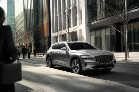 2027 Genesis Electrified GV70 parked in a scenic urban environment