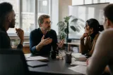 A group of researchers discussing the implications of AI ethics.