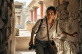 A dynamic scene from Resonance: A Plague Tale Legacy with character Sophia in action while exploring vibrant Mediterranean ruins.