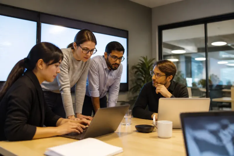 A team brainstorming flexible infrastructure plans in a strategy meeting.
