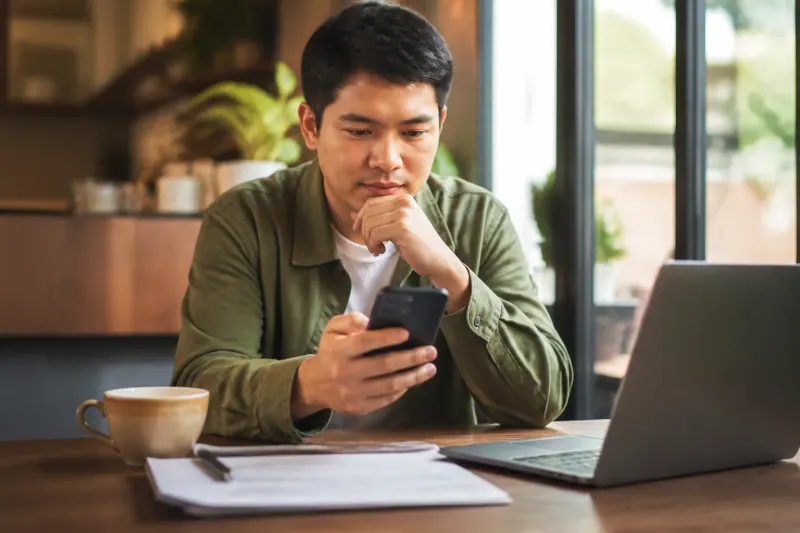 A digital exchange platform visible on a smartphone screen while held by a user.