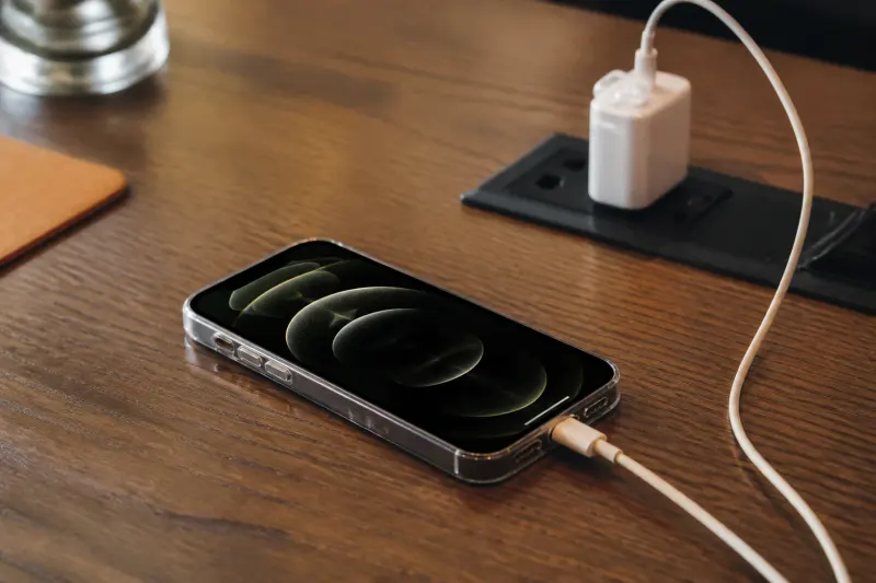 A side view of the iPhone 18 Pro connected to a charger.
