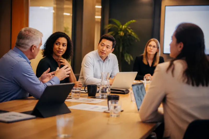 Risk assessment meeting among crypto investors.