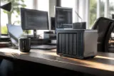 Beelink ME Pro Creator Edition NAS unit on a desk showcasing its sleek design and connectivity ports.