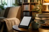 The Amazon Kindle (2026) displayed on a desk among reading materials.