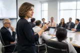 An academic seminar showcasing scientists discussing OpenAI's research advancements.