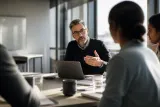 A security leader in a modern office, discussing risk and resilience.